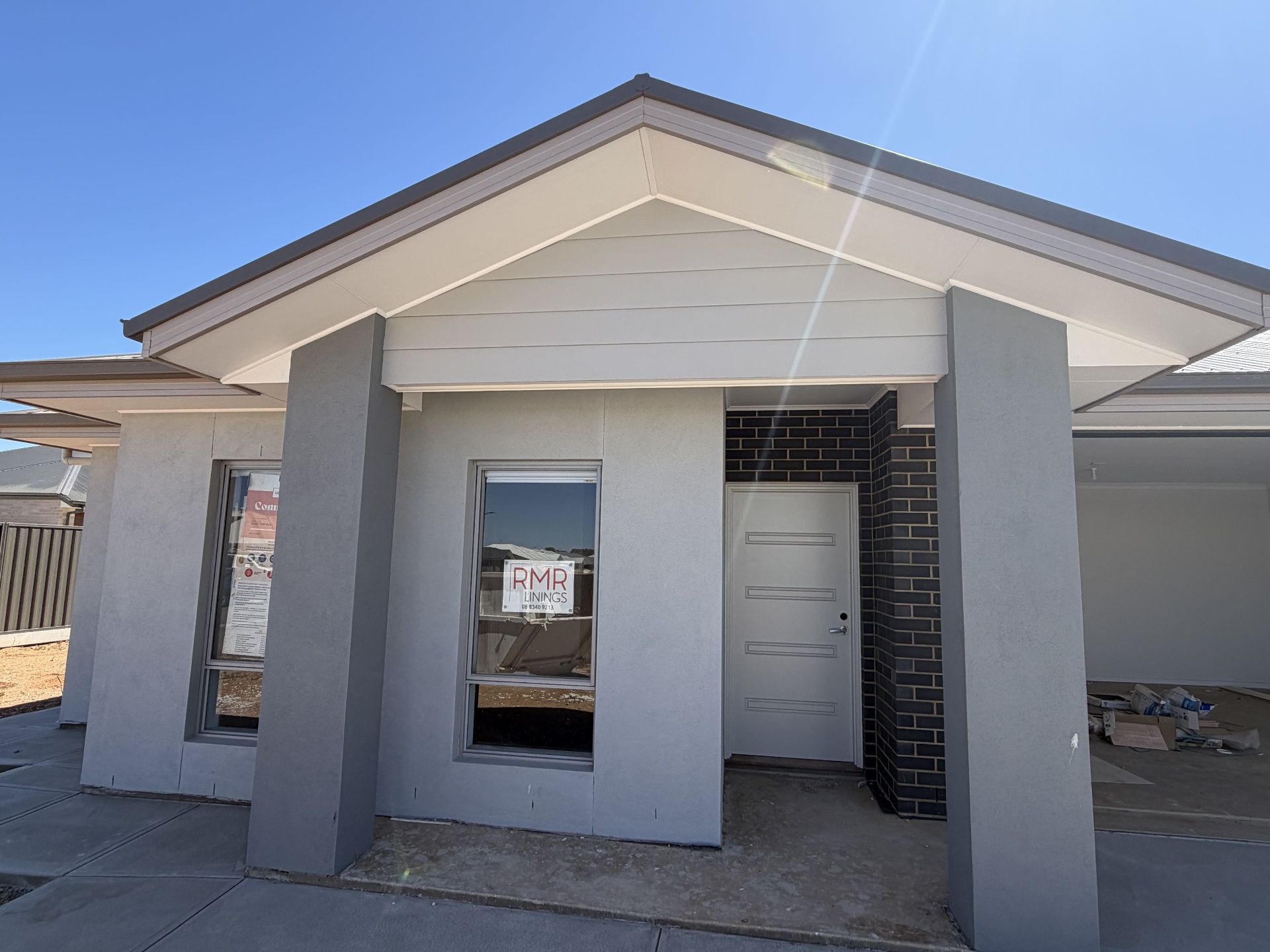Freshly painted modern Adelaide home with gabled porch by Sana Painting